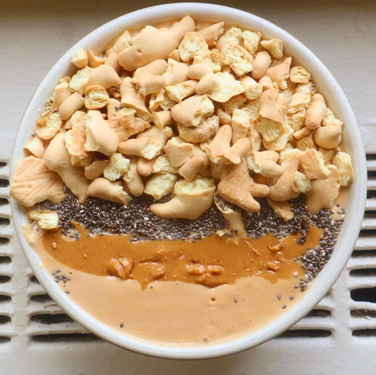 Smoothie bowl topped with crushed animal crackers