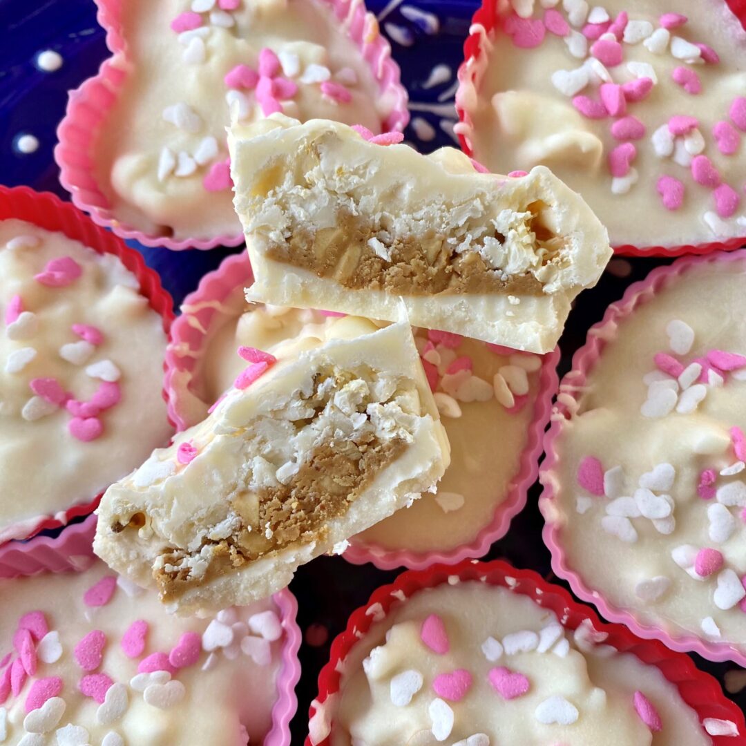 White chocolate peanut butter cup stuff with popcorn shaped like hearts.