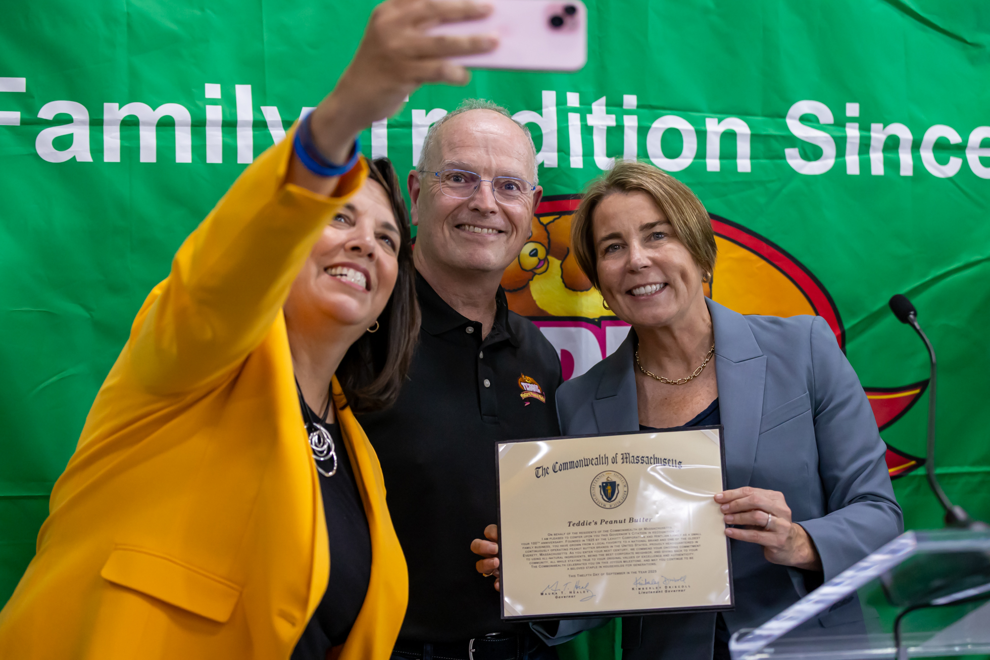 LT. Kim Driscoll, Jamie Hintlian, and Gov. Healey pose for a picture.